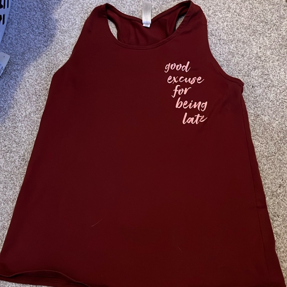 Red tank top with “good excuse for being late”